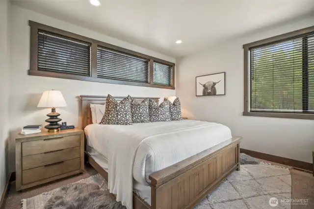 Main floor primary suite provides a quiet oasis