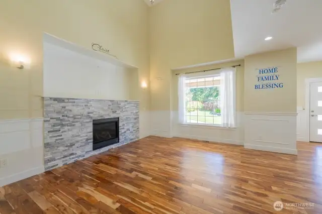 Beautiful mantle and picturique window looking out to the front patio.