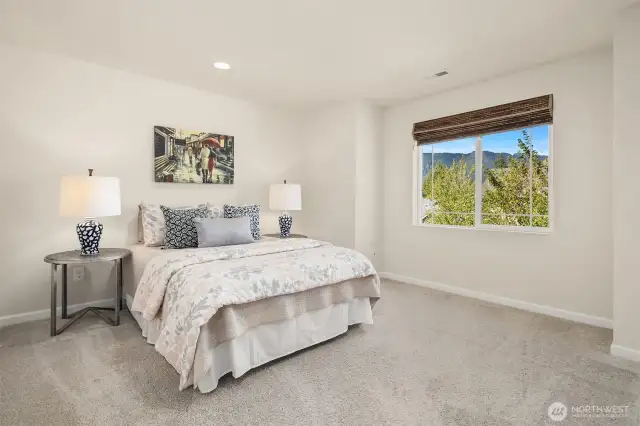 Second bedroom with queen bed on upper level.