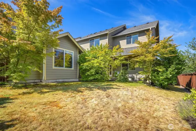 Backyard with mature landscaping.