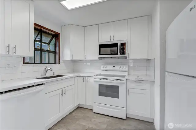 Remodeled kitchen with quartz counter top.