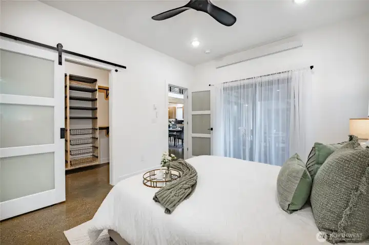 Ceiling fan and a private access to back patio through the sliding door.