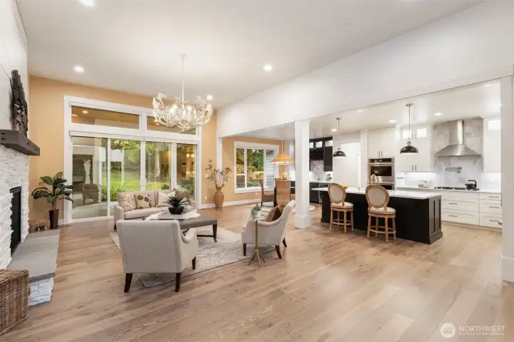 Great room sliders open up to covered patio with gas fireplace.