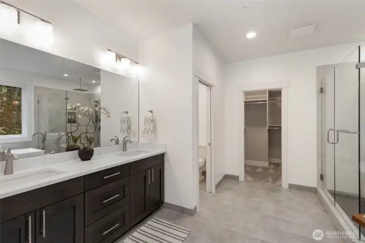 Primary looking into custom walk in closet.