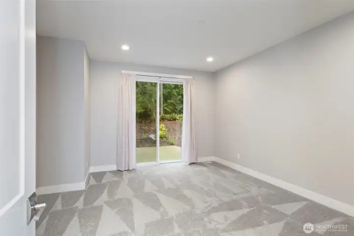 #3 bedroom with slider leading to rear patio.