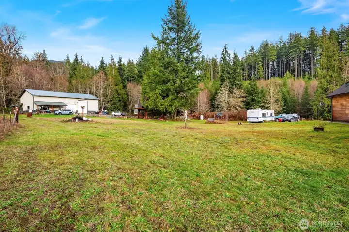 large backyard with an impressive shop