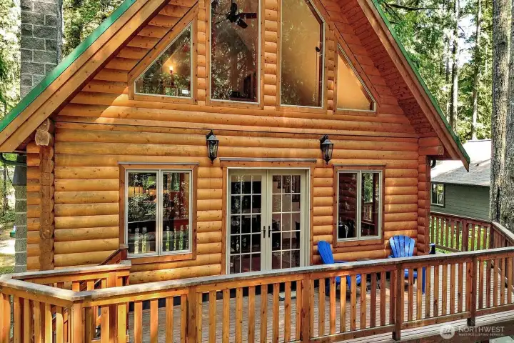 Windows and doors are of double glass high quality wood construction with Aluminum clad exterior profiles for maintenance free life and quality hardware including top and bottom locking pins for doors, operated by door handle.