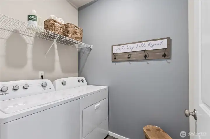 Dedicated laundry room keeps things tidy and can fit full size washer and dryer. Actual home is under construction. Colors, materials, and features may vary. See site agent for details.