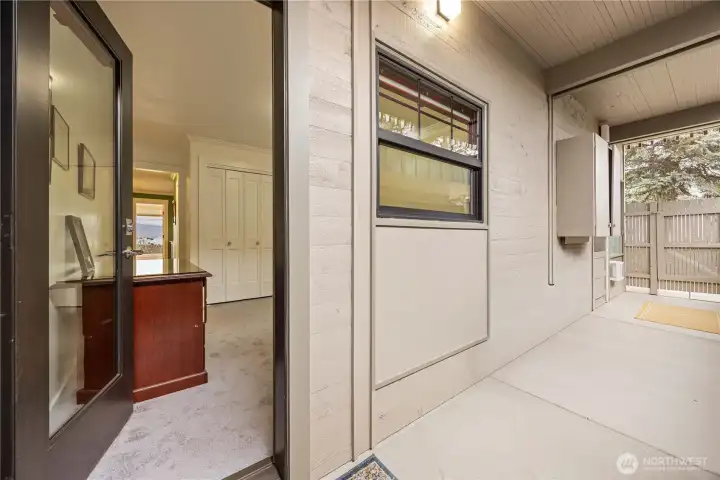 From this guest/office room, there is a doorway to the back deck which is enclosed for privacy and storage.