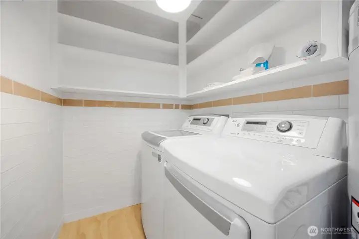 Laundry is conveniently located opposite the kitchen, for those gifted with multitasking.