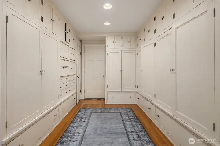 The primary suite walk-in closet (approximately 11 feet by 16 feet).