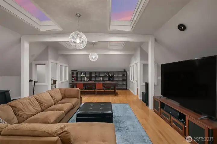 On the far end of the family room are two windowed offices. The configuration of this level allows the entire top floor to function as a potential mother-in-law, nanny or quest suite in addition to serving as a family/media level.