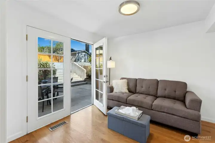 French doors lead to the multi-level patio and back yard.