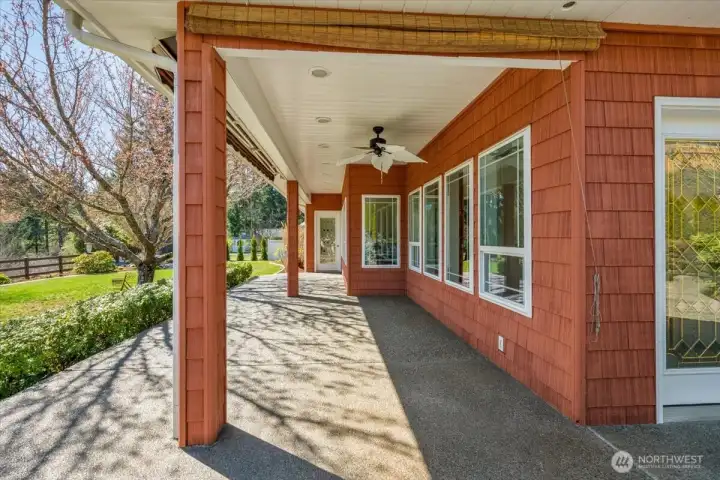 Enjoy morning coffee on this beautiful patio with fan and sunshade