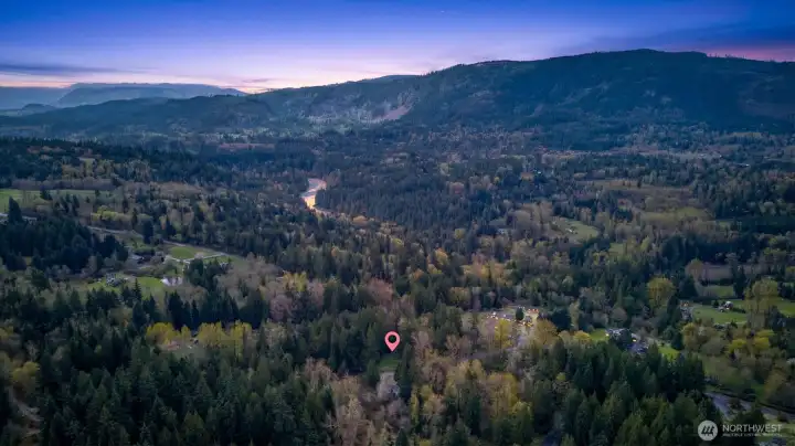 Private, wooded parcel with sweeping valley and mountain views, plus a scenic river nearby—peaceful setting just minutes from town.