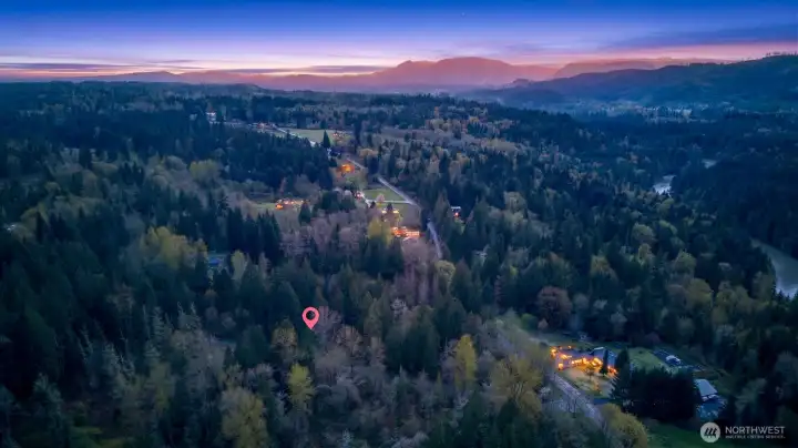 Peaceful and secluded acreage tucked into a quiet, established area with upscale homes nearby, showcasing stunning sunset views and a perfect blend of privacy and community.