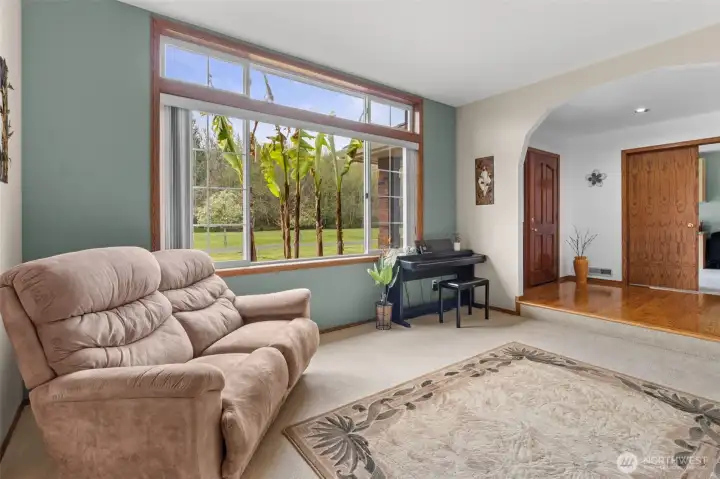 Formal living room with home office to right of front door.