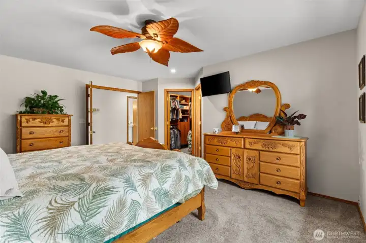 Primary bedroom with walk-in closet