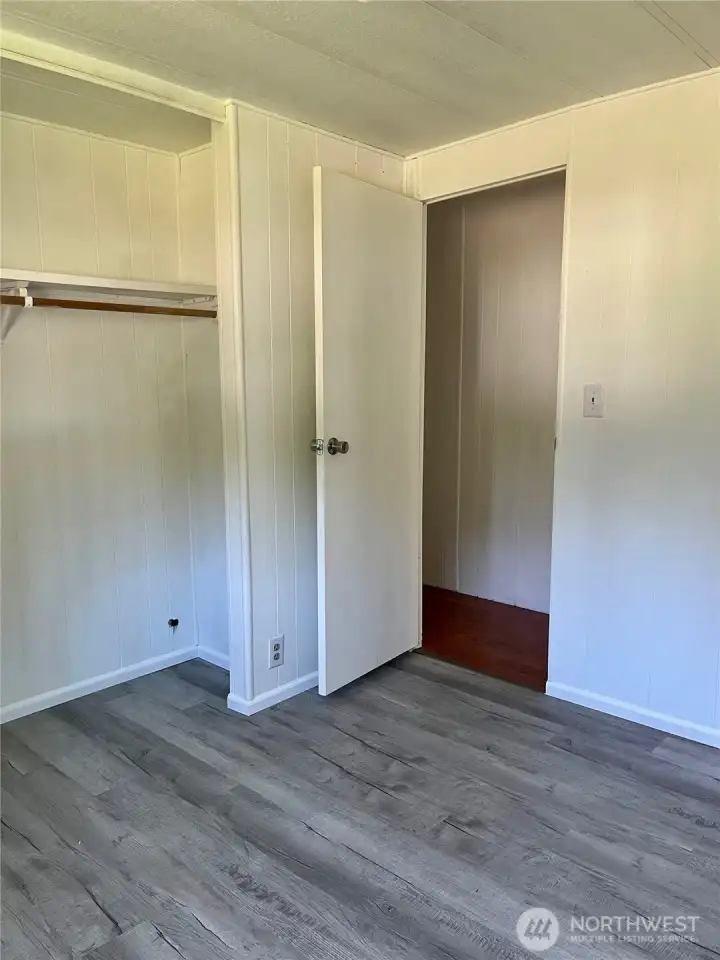 Bedroom has new flooring and large closet