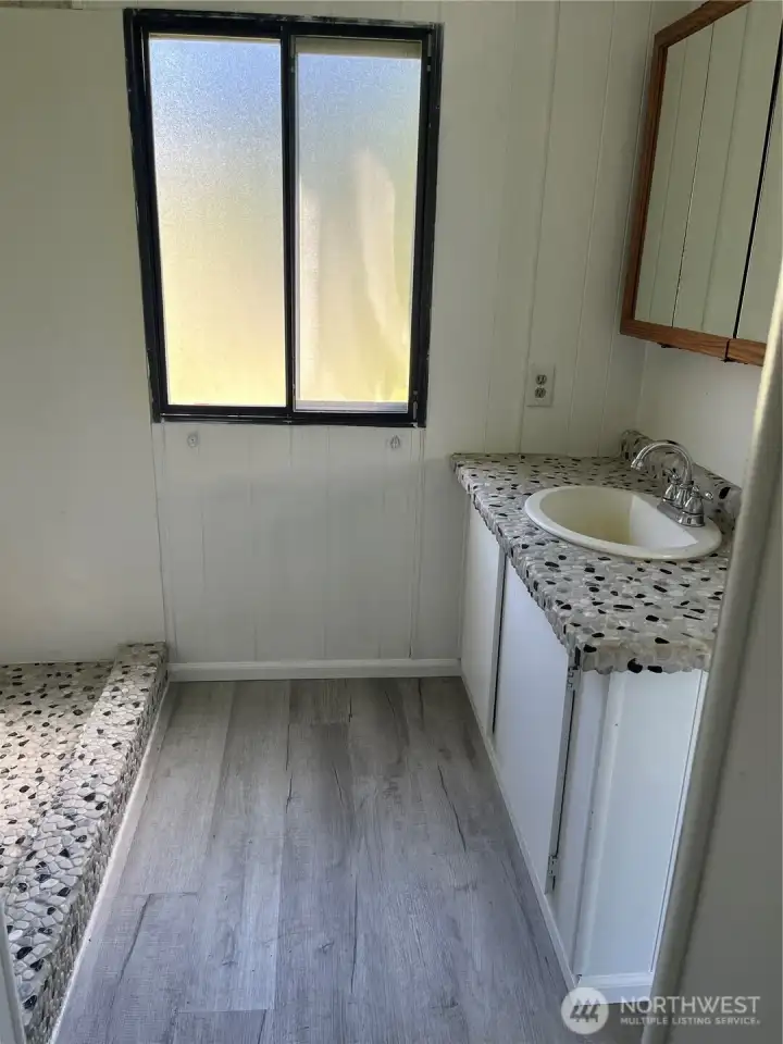 Custom shower and countertop make this bathroom special