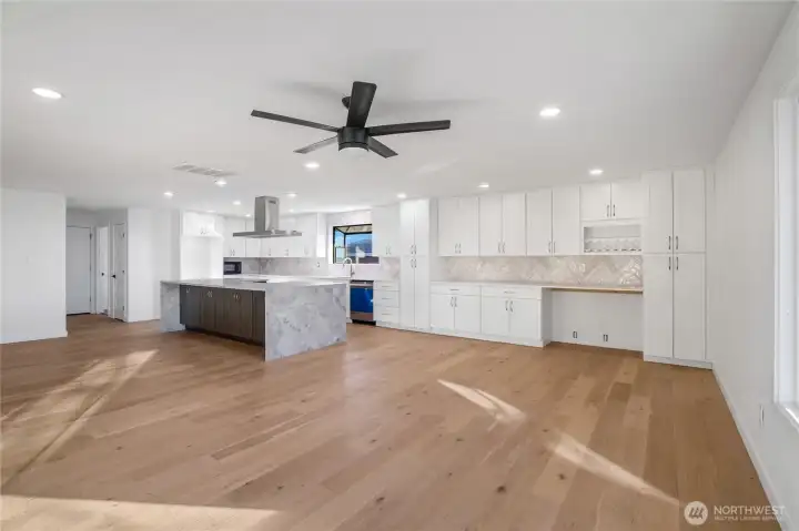 Open kitchen layout connecting to dining and living areas