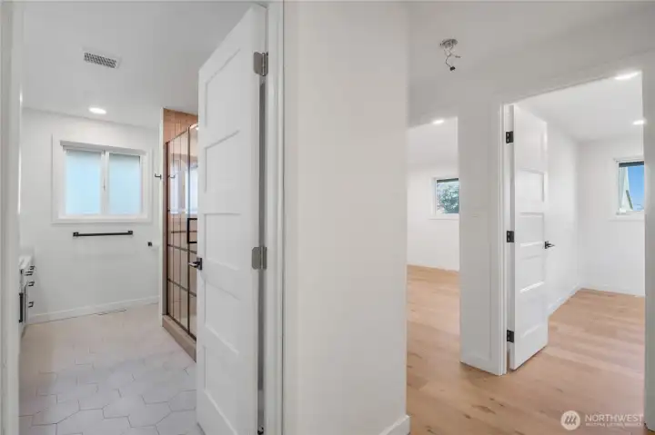 Interior hallway connecting living spaces to bedrooms, designed for functional flow and separation of living and sleeping areas