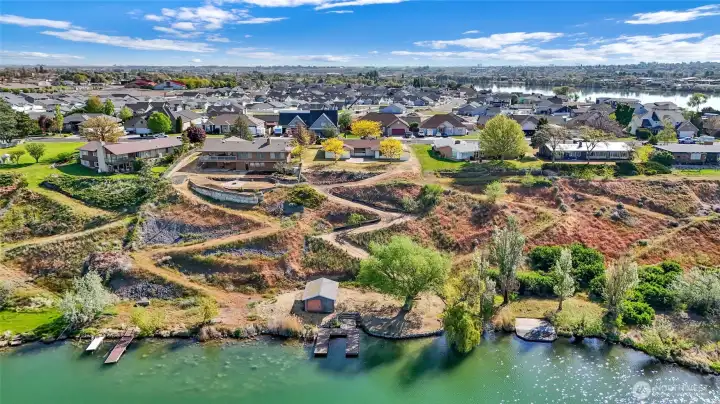 Backyard oriented toward lake and sunset views