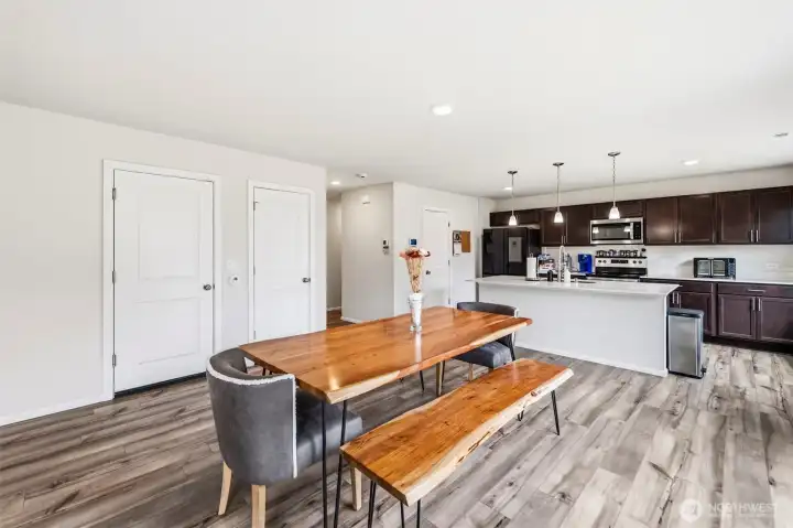 Open-concept living at its best — the dining area connects effortlessly to the kitchen, with backyard access and abundant natural light.