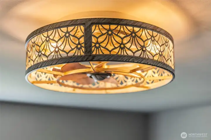 Designer ceiling fixture adds a warm, decorative touch.