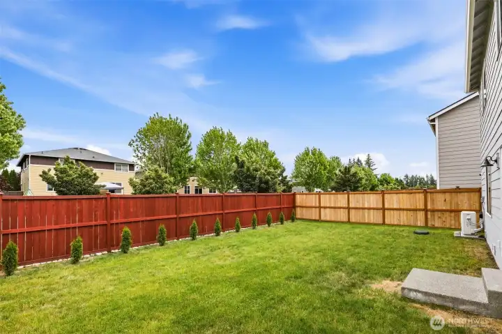 Generous fenced yard with plenty of room to play, garden, or entertain—plus easy-to-maintain landscaping.