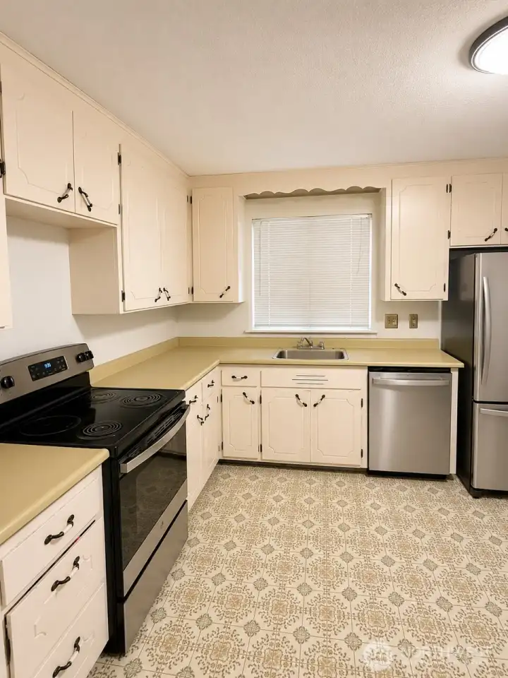 Kitchen with stainless steel appliances. Kitchen with stainless steel appliances.