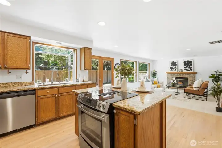 Functional open-concept design connects seamlessly to the family room.