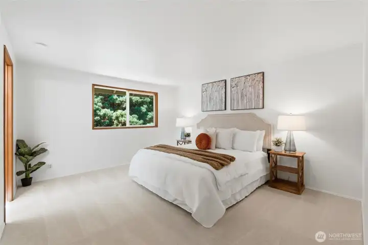 Spacious retreat tucked upstairs for privacy. Natural light creates a bright and welcoming feel.
