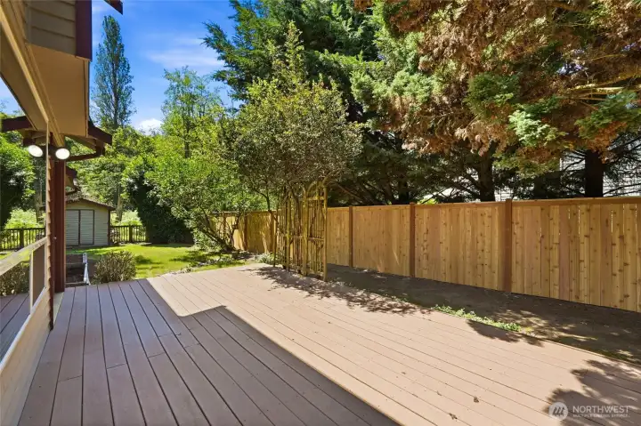 Expansive deck overlooks the native greenbelt. Perfect for outdoor dining and entertaining.