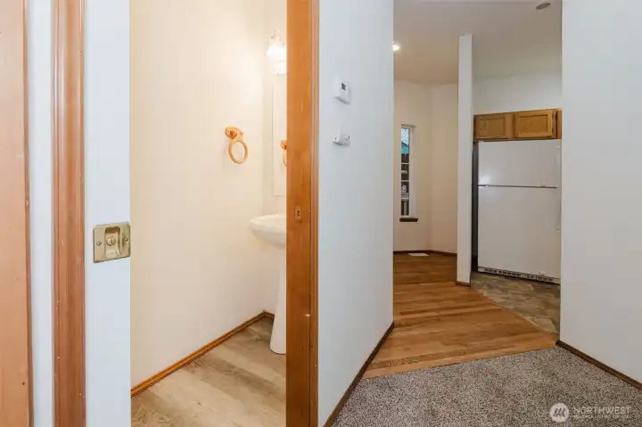 Back out of the utility room to see the hall half bath. Back out of the utility room to see the hall half bath.