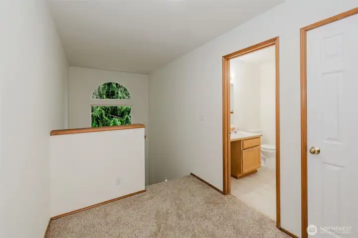 Ok, going upstairs on the landing looking back south at your cedar tree. Main bath to your right. Closet on the far right and bedrooms behind you. Ok, going upstairs on the landing looking back south at your cedar tree. Main bath to your right. Closet on the far right and bedrooms behind you.