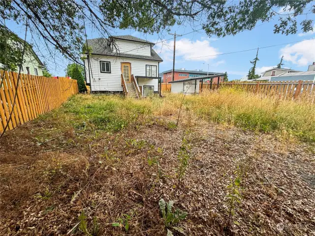 HUGE yard w/ plenty of parking & storage outbuilding