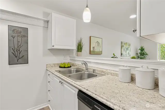 Bright white cabinets & lovely countertops.