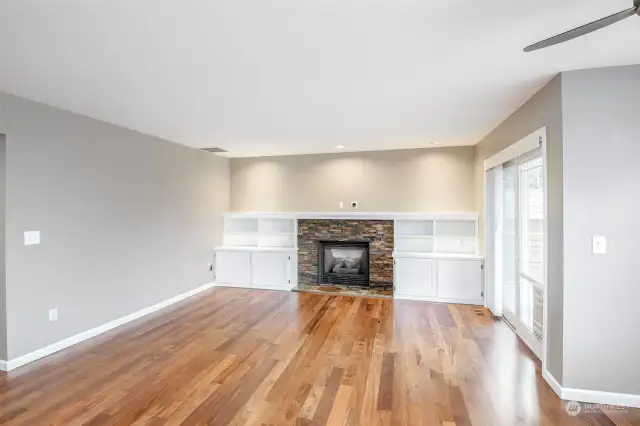 Family room with custom built cabinets and gas fireplace.