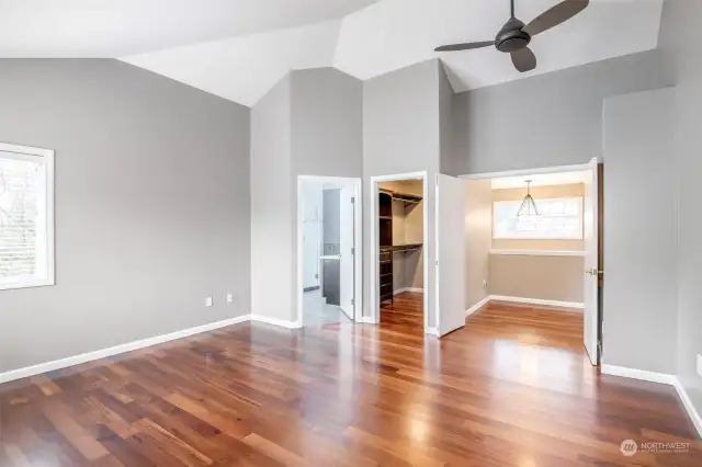 Primary bedroom with walk in customized  closet system.