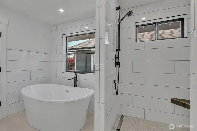Primary soaking tub and private shower