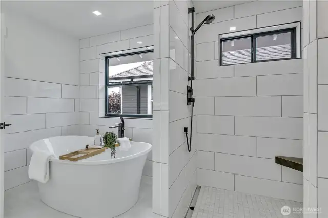 Primary Bath w/soaking tub and private shower featuring dual sprays