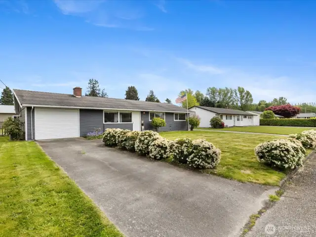 Attached garage plus additional driveway & SHOP