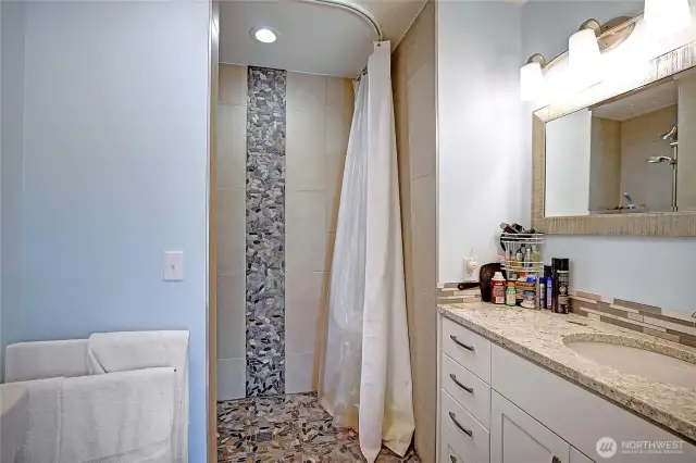 Guest home bathroom with roll in shower...