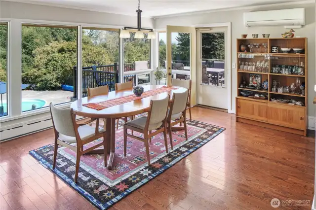 You will never tire of the views from the main level of this MCM home. Step outside the door to enjoy your meals al fresco.