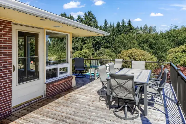 The new cedar deck is just outside the dining room. There are multiples space for seating areas. Revel in views of your backyard, gardens, and Mount Rainier aka Mt. Tahoma. You can even see Little Tahoma Peak on a clear day!