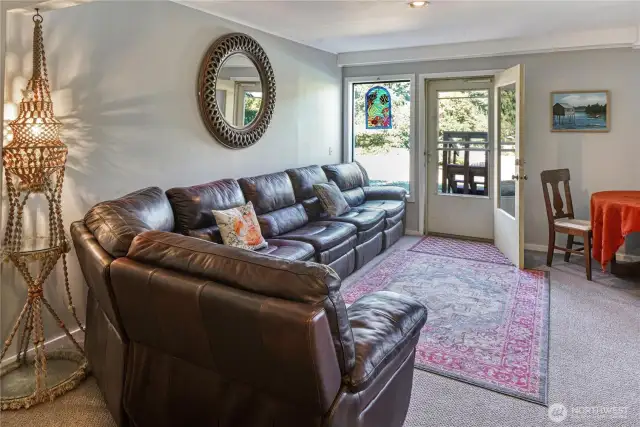Down a flight of stairs, find yourself in this expansive second living room, rec room, tv room – whatever your heart desires. Maybe turn the lower level into a multi-gen living area. The options are practically endless. Right outside is the lower patio with access to your new hot tub, pool and lush established gardens.