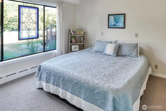 You may be in the daylight basement but the light from the windows gives you the feeling of being on the main level. One of two downstairs bedrooms.