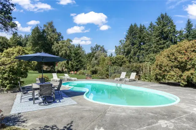 The expansive pool deck is made for entertaining! When you get tired of swimming, play a game of bocce or badminton on your level lower yard.