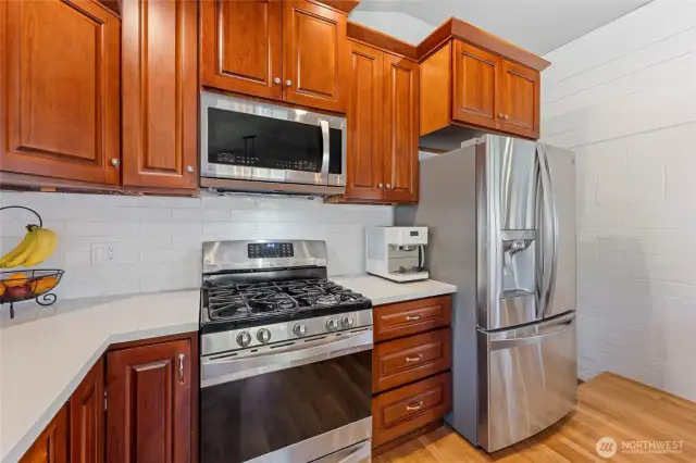 More pantry space on the lower level just past the refrigerator...